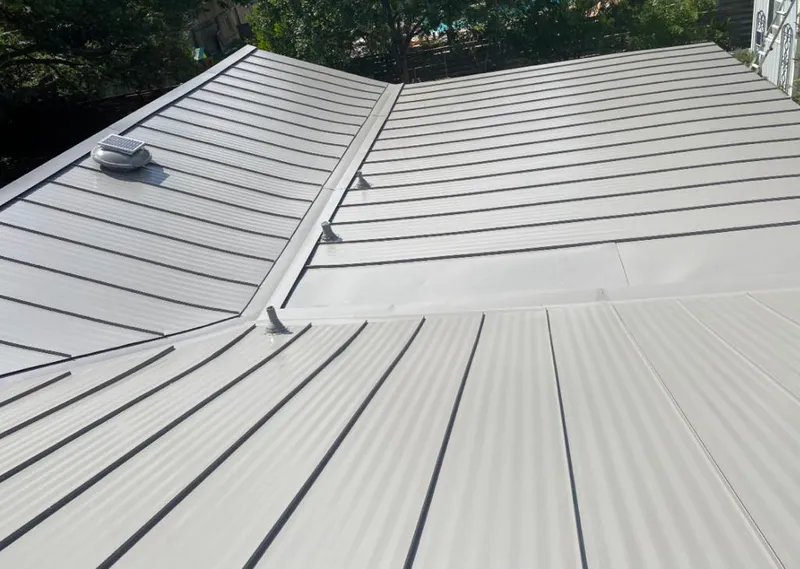 Solar attic fan installed on a metal roof for Roof Ventilation in Blackfoot